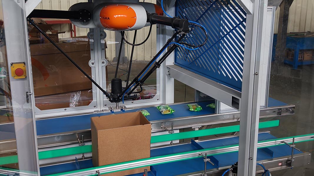A delta robot picking and placing products into cases