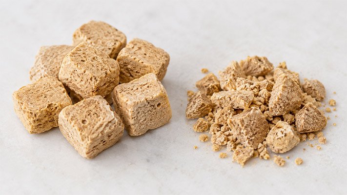 whole and broken freeze-dried pet food pieces